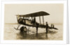 Plane No. 9 on the shore at Ramsey belonging to A.V. Roe and Co. Ltd. G.W. Kewin, town surveyor climbing into the cockpit by Thomas Horsfell Midwood