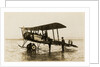 Plane No. 9 on the shore at Ramsey belonging to A.V. Roe and Co. Ltd. G.W. Kewin, town surveyor climbing into the cockpit by Thomas Horsfell Midwood