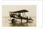 Plane No. 9 on the shore at Ramsey belonging to A.V. Roe and Co. Ltd. G.W. Kewin, town surveyor climbing into the cockpit by Thomas Horsfell Midwood