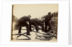 Sailors putting rope on a steamer by Anonymous