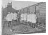 First World War Internee in front of hut with medical/hospital staff, Camp 2, Knockaloe by W H Warburton