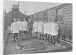 First World War Internee in front of hut with medical/hospital staff, Camp 2, Knockaloe by W H Warburton