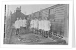 First World War Internee in front of hut with medical/hospital staff, Camp 2, Knockaloe by W H Warburton