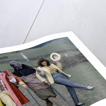 Colin Baker with Nicola Bryant who plays Perpugilliam "Peri" Brown during filming at Butser Ancient Farm Project, Butser Hill, Hampshire for the story The Mysterious Planet, part of the larger Trial of A Time Lord narrative. 10th April 1986. by Anonymous
