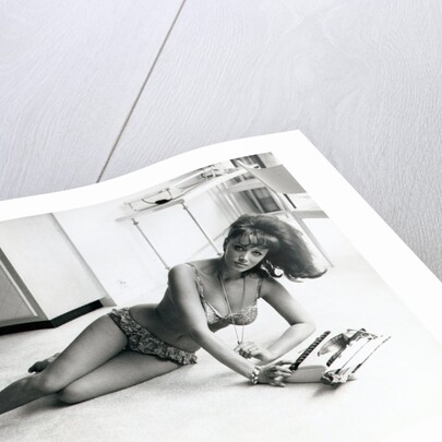 Jackie Collins, author and actress, and sister to Joan Collins, pictured in her Hampstead, London, flat on 6th August 1964 by Daily Mirror