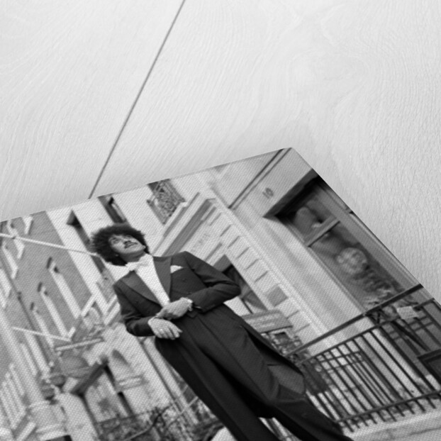 Phil Lynott in London, modelling clothes from Saville Row. 1983 by Mike Maloney