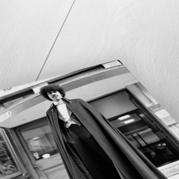 Phil Lynott in London, modelling clothes from Saville Row. 1983 by Mike Maloney