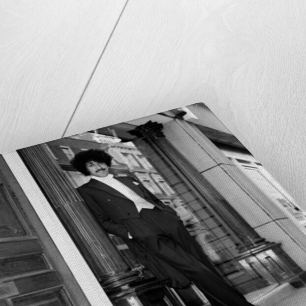 Phil Lynott in London, modelling clothes from Saville Row. 1983 by Mike Maloney