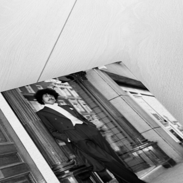 Phil Lynott in London, modelling clothes from Saville Row. 1983 by Mike Maloney