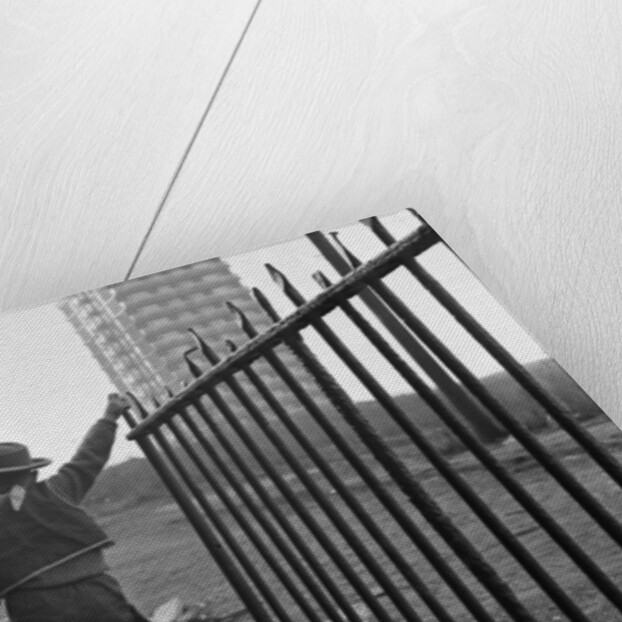 Young boy playing cowboys in Collyhurst by Dennis Hussey