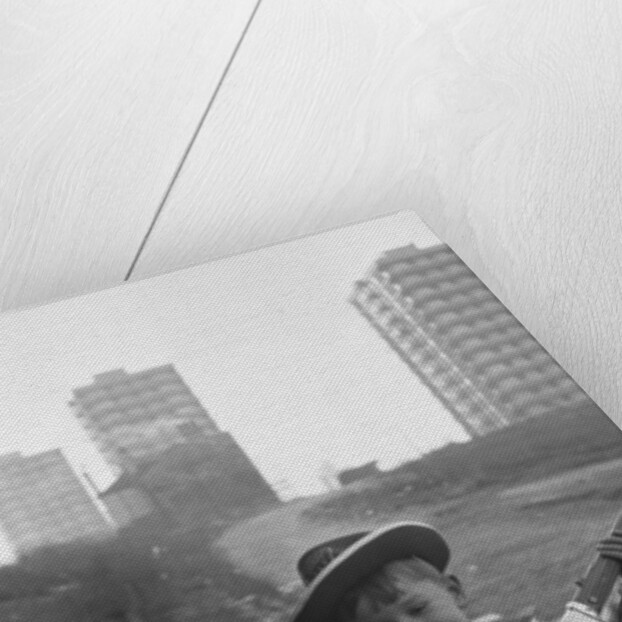 Young boy playing cowboys in Collyhurst by Dennis Hussey