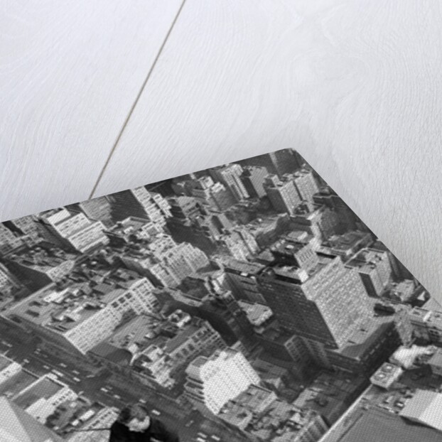 Workmen busy cleaning windows 1000 ft up the Empire State building by Daily Herald