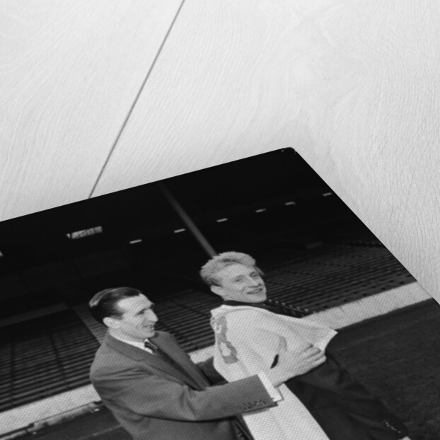 Manchester City new signing Denis Law with Ken Barnes trying his new shirt for size by Thomas