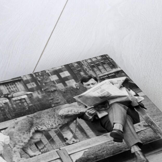 John reads on by Staff