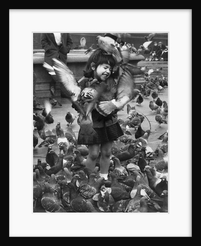 Young girl surrounded by hungry pigeons by Anonymous