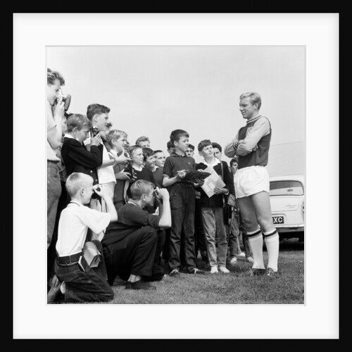 Bobby Moore poses for young fans by Monte Fresco