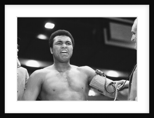 Muhammad Ali having his blood pressure taken by Monre Fresco