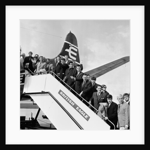 Everton team members wave before their plane departs from Speke airport by Charlie Owens