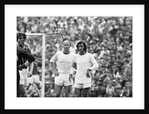 Bobby Charlton and George Best await a free kick 1969 by Monte Fresco