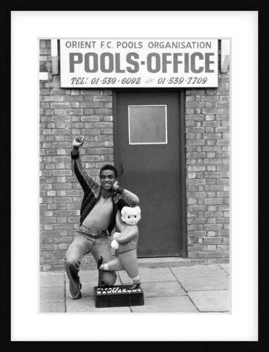 Laurie Cunningham outside Leyton Orient Football Club Pools Office. by Monte Fresco