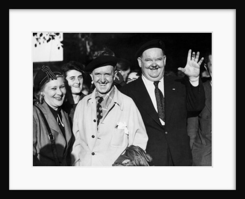 Stan laurel and Oliver hardy outside Coventry station August 1947. by Staff
