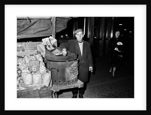 Hot Chestnut hawker in Leicester Square, London. 9th October 1963. by Tanner