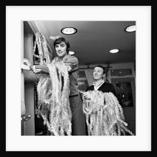 George Best decorating his Edwardian boutique 1967 by Staff