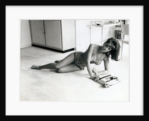 Jackie Collins, author and actress, and sister to Joan Collins, pictured in her Hampstead, London, flat on 6th August 1964 by Daily Mirror