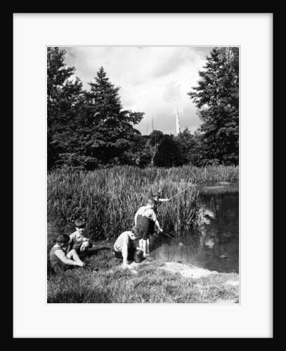 Boys fishing in the river circa 1939 by Staff