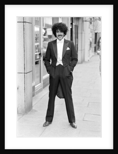 Phil Lynott in London, modelling clothes from Saville Row. 1983 by Mike Maloney