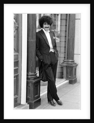 Phil Lynott in London, modelling clothes from Saville Row. 1983 by Mike Maloney