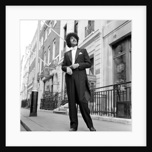 Phil Lynott in London, modelling clothes from Saville Row. 1983 by Mike Maloney