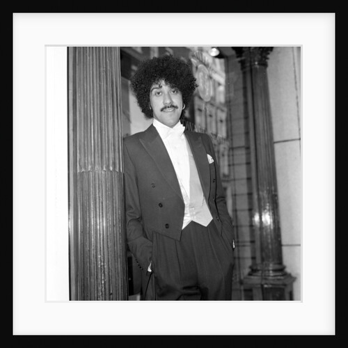 Phil Lynott in London, modelling clothes from Saville Row. 1983 by Mike Maloney