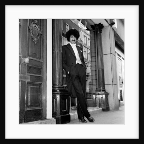 Phil Lynott in London, modelling clothes from Saville Row. 1983 by Mike Maloney