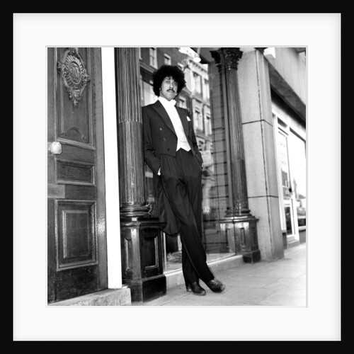 Phil Lynott in London, modelling clothes from Saville Row. 1983 by Mike Maloney