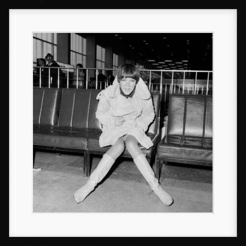 Mary Quant, at London Airport, on her way to Paris to go to a fancy dress ball. by Staff