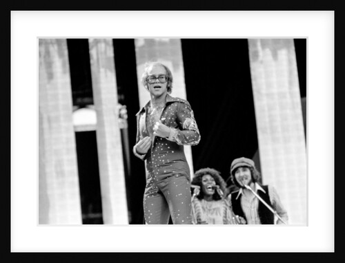 Elton John performing on stage at Wembley Stadium., London, England in June 1975 by Chris Barham