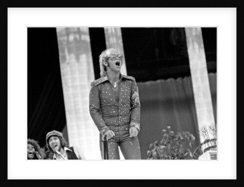 Elton John performing on stage at Wembley Stadium., London, England in June 1975 by Chris Barham