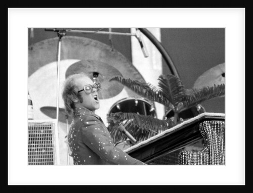 Elton John performing on stage at Wembley Stadium., London, England in June 1975 by Chris Barham