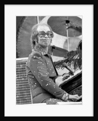 Elton John performing on stage at Wembley Stadium., London, England in June 1975 by Chris Barham