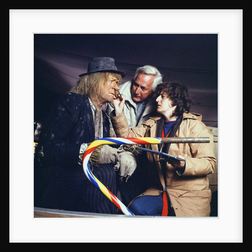 A make-up artist touches up Jon Pertwee's make-up by Anonymous