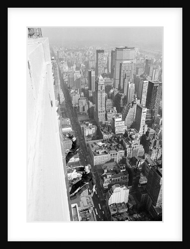 Workmen busy cleaning windows 1000 ft up the Empire State building by Daily Herald