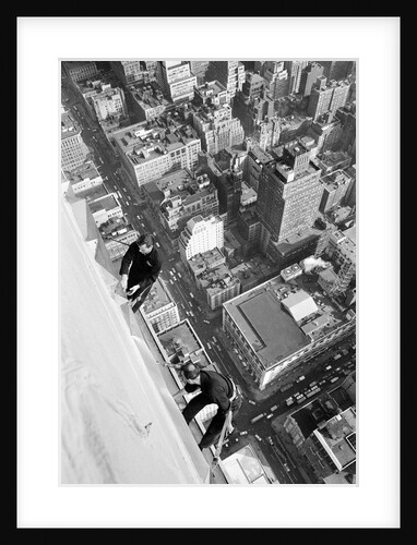 Workmen busy cleaning windows 1000 ft up the Empire State building by Daily Herald