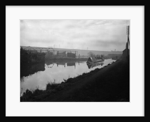 A narrow boat makes it way through the Manure lock basin at Wolverhampton by Carter