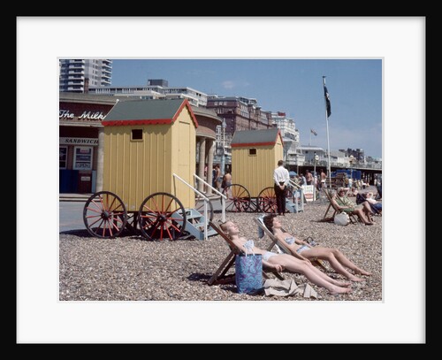 Old style bathing huts on the sea front at Brighton by Library
