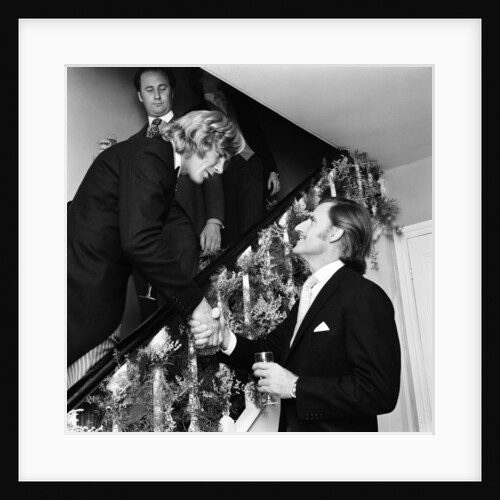 Motor racing driver & groom James Hunt shakes hands with Graham Hill on his wedding day by Anonymous