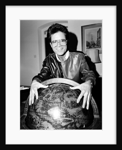 Cliff Richard with a globe by Anonymous