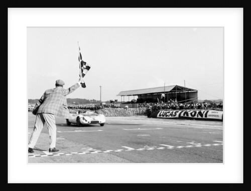 Jim Clark takes the checkered flag by Staff