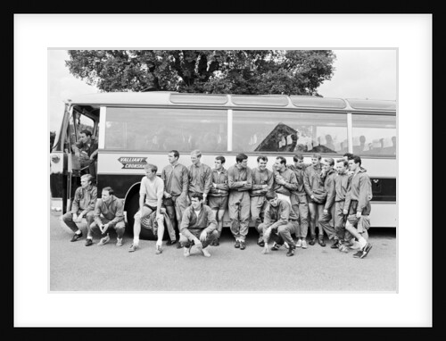 The England squad stand next to their coach as they relax at Hendon Hall Hotel by Anonymous