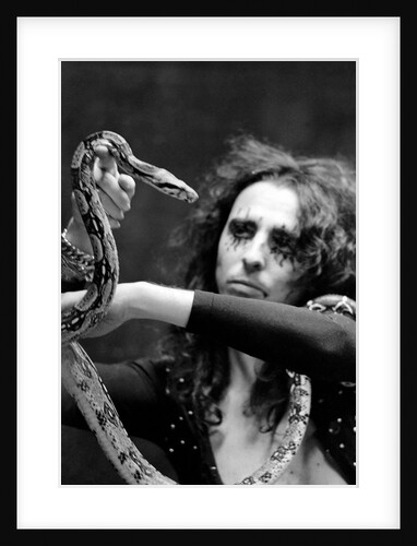 Alice Cooper with his pet boa constrictor by Anonymous